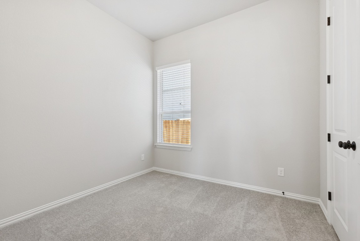 247 Grayson Elm Pass Dripping Springs, TX 78620 - Photo 24 of 39 an empty room with a window