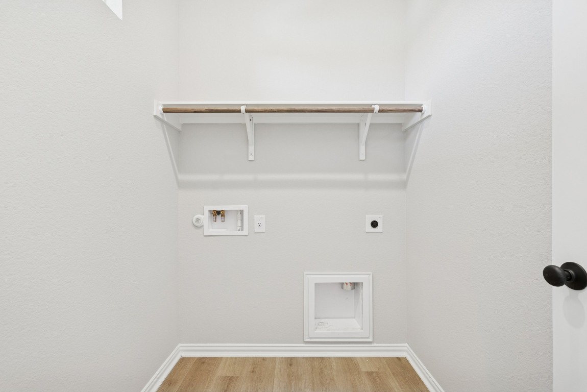 247 Grayson Elm Pass Dripping Springs, TX 78620 - Photo 26 of 39 a view of walk in closet with empty racks