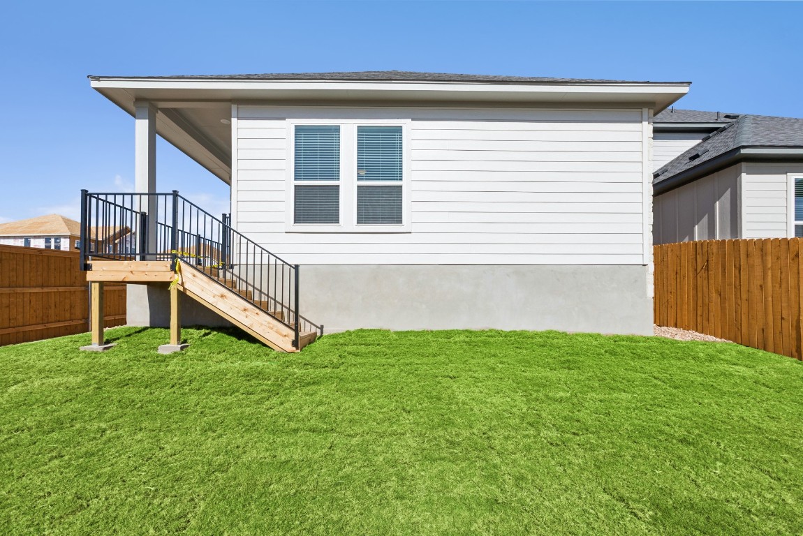 247 Grayson Elm Pass Dripping Springs, TX 78620 - Photo 29 of 39 a house with garden in front of it