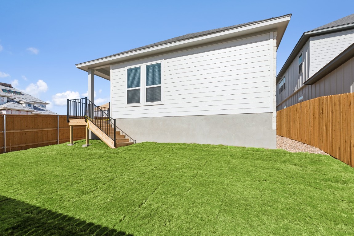 247 Grayson Elm Pass Dripping Springs, TX 78620 - Photo 30 of 39 a house view with a backyard space