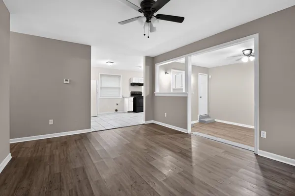 wooden floor in an empty room with a window