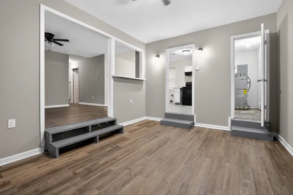 wooden floor in an empty room with a window