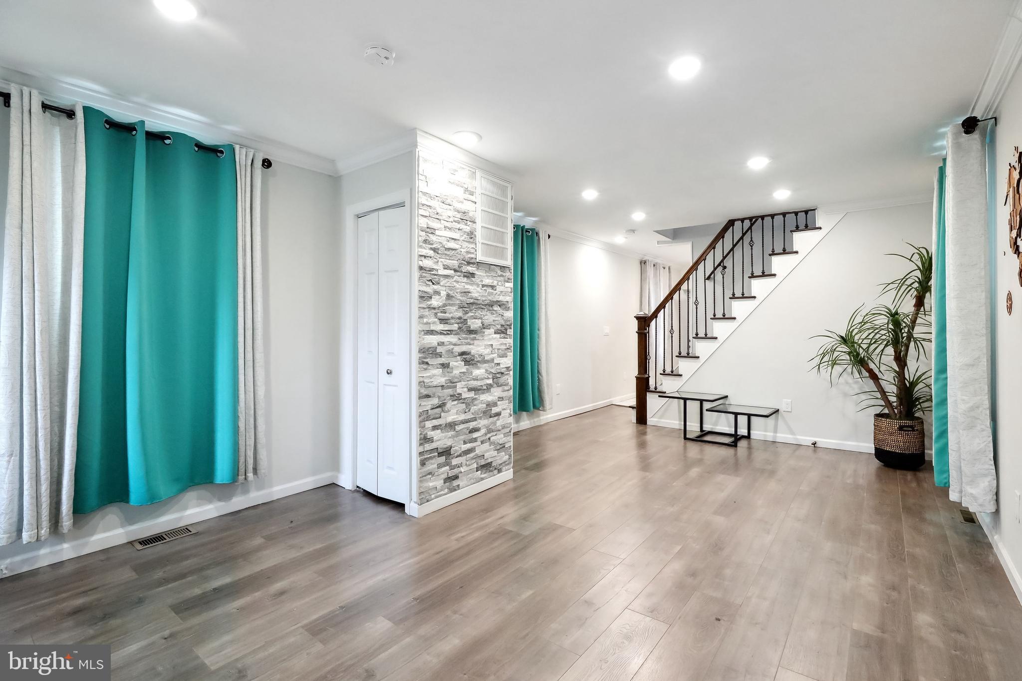 111 Adams Street Riverside, NJ 08075 - Photo 3 of 32 an entryway at livingroom with furniture and stairs