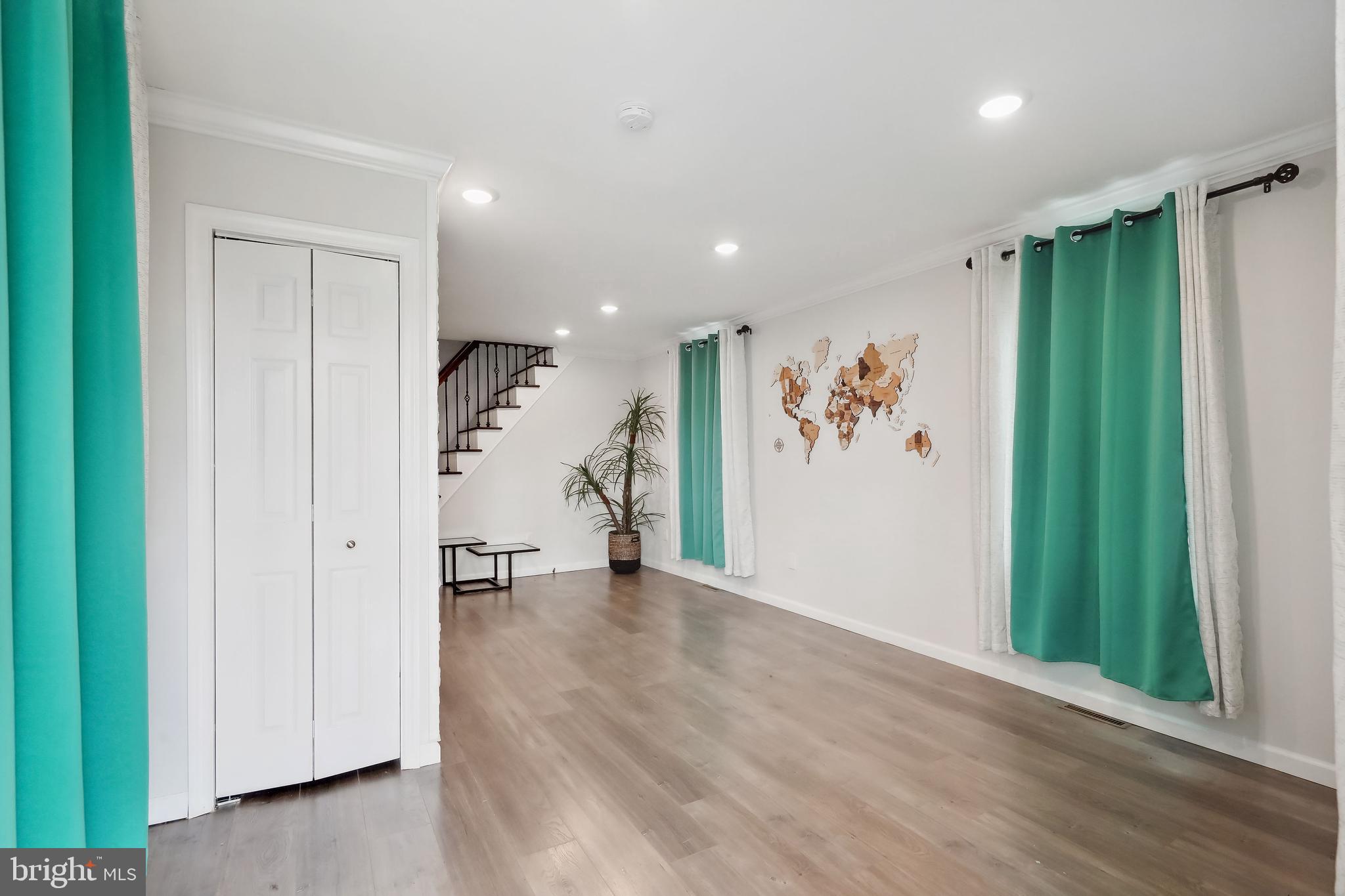 111 Adams Street Riverside, NJ 08075 - Photo 6 of 32 a view of a hallway with wooden floor and entryway