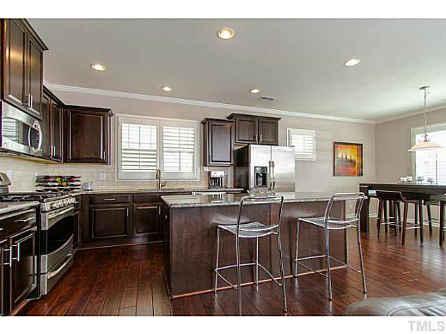 1410 Rodessa Run Raleigh, NC 27607 - Photo 8 of 25 GOURMET KITCHEN WITH GENEROUS ISLAND FOR SEATING. Kitchen