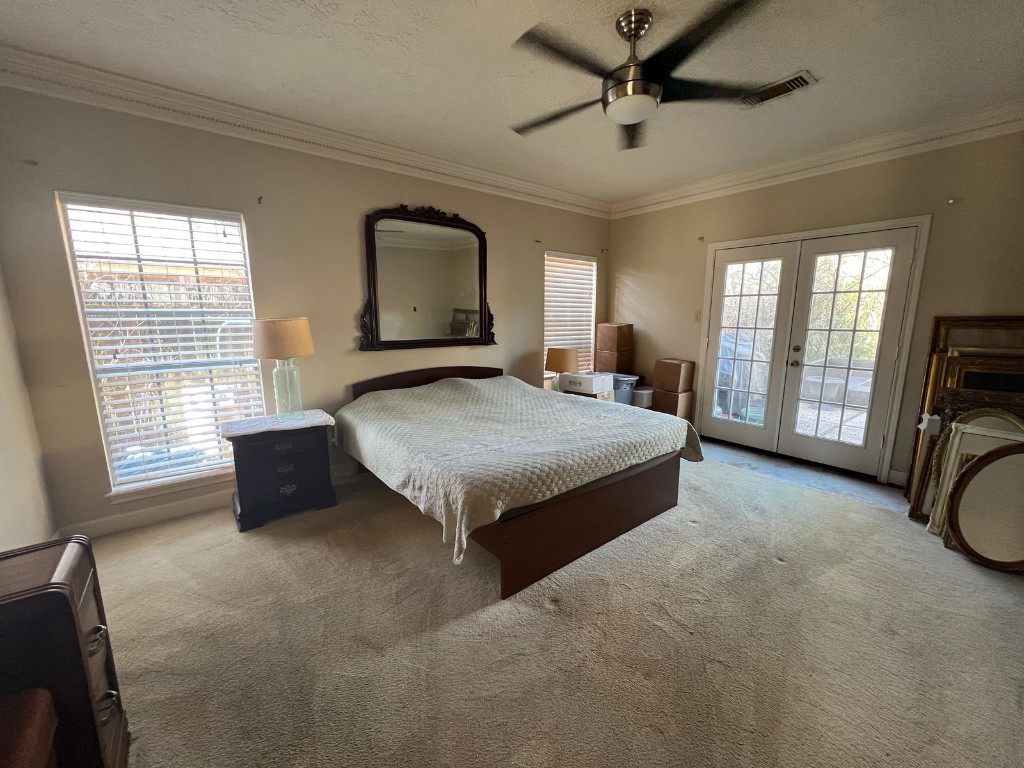 16702 Mandeville Court Spring, TX 77379 - Photo 13 of 15 a bedroom with a bed a dresser next to a window