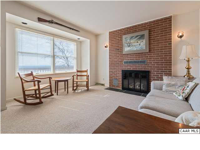 460 Farmview Road Stanardsville, VA 22973 - Photo 8 of 25 Living room provides warmth by the fireplace when needed.