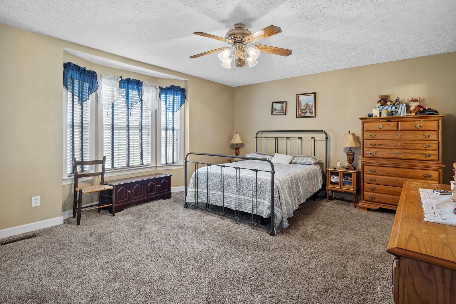8035 Cedar Grove Road Cross Plains, TN 37049 - Photo 16 of 40 a bedroom with a bed and a chandelier