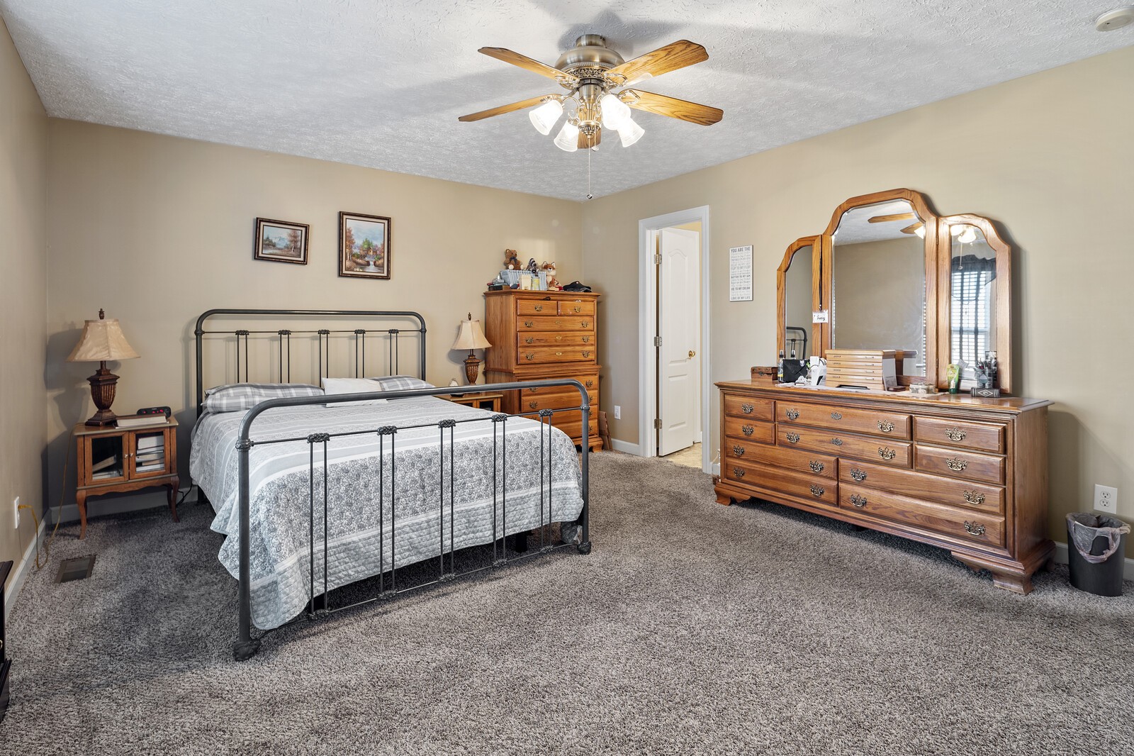 8035 Cedar Grove Road Cross Plains, TN 37049 - Photo 17 of 40 a bedroom with a bed and a chandelier