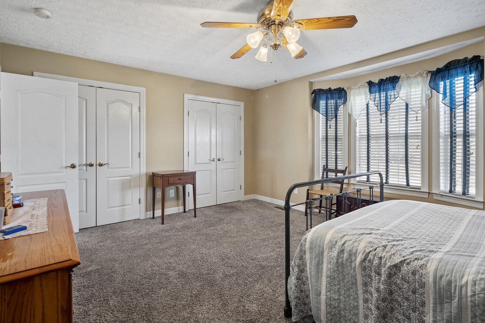 8035 Cedar Grove Road Cross Plains, TN 37049 - Photo 18 of 40 a bedroom with a bed and a chandelier