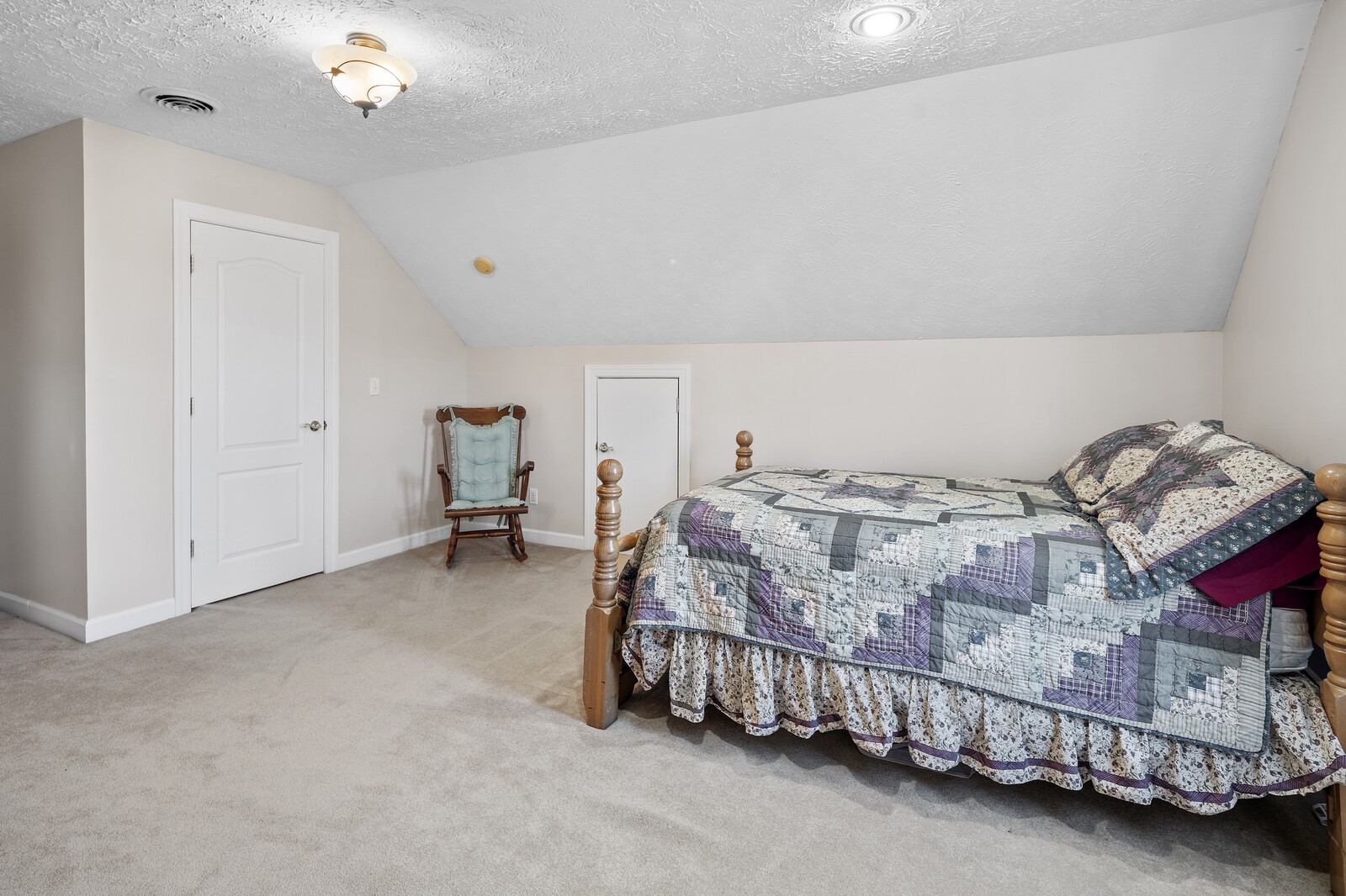 8035 Cedar Grove Road Cross Plains, TN 37049 - Photo 29 of 40 a bedroom with a bed and a chandelier