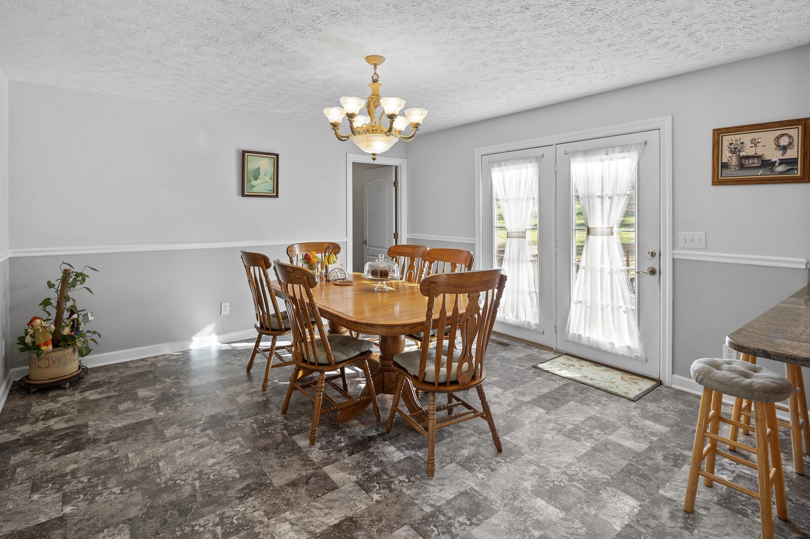 8035 Cedar Grove Road Cross Plains, TN 37049 - Photo 36 of 40 a view of a dining room with furniture and chandelier