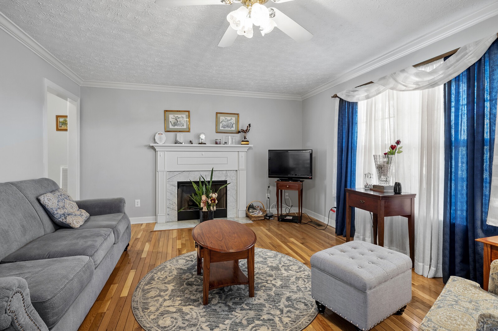8035 Cedar Grove Road Cross Plains, TN 37049 - Photo 8 of 40 a living room with furniture and a fireplace