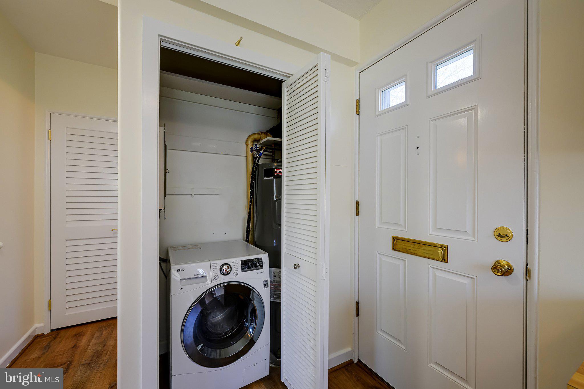 39 Ridge Road Greenbelt, MD 20770 - Photo 12 of 19 a view of a hallway with washer and dryer