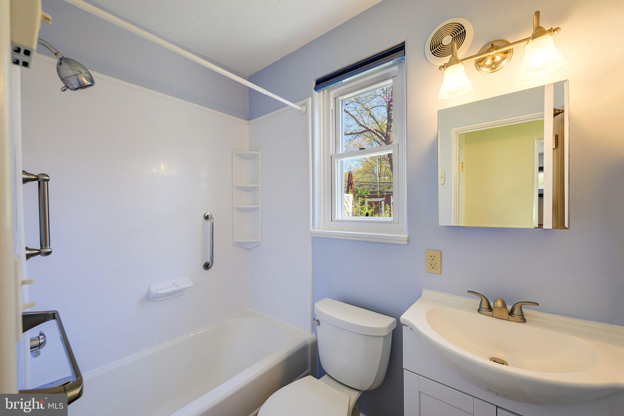 39 Ridge Road Greenbelt, MD 20770 - Photo 15 of 19 a bathroom with a sink and a mirror