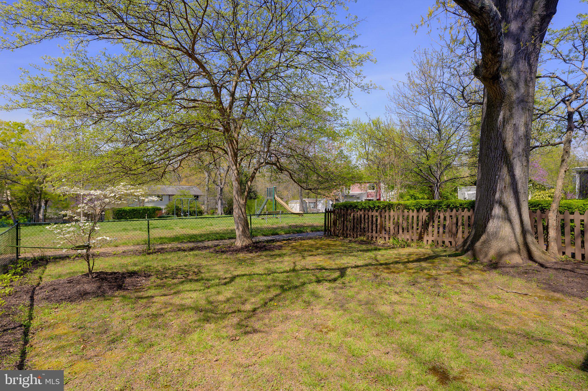 39 Ridge Road Greenbelt, MD 20770 - Photo 18 of 19 a view of a yard with wooden fence