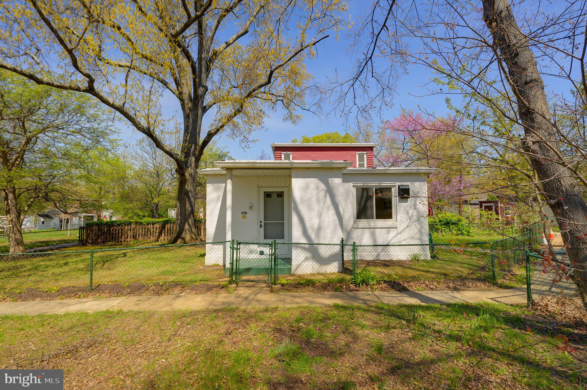 39 Ridge Road Greenbelt, MD 20770 - Photo 2 of 19 a view of a house with a yard