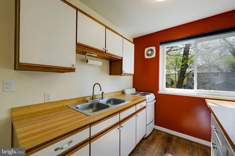 a kitchen with a sink and a window