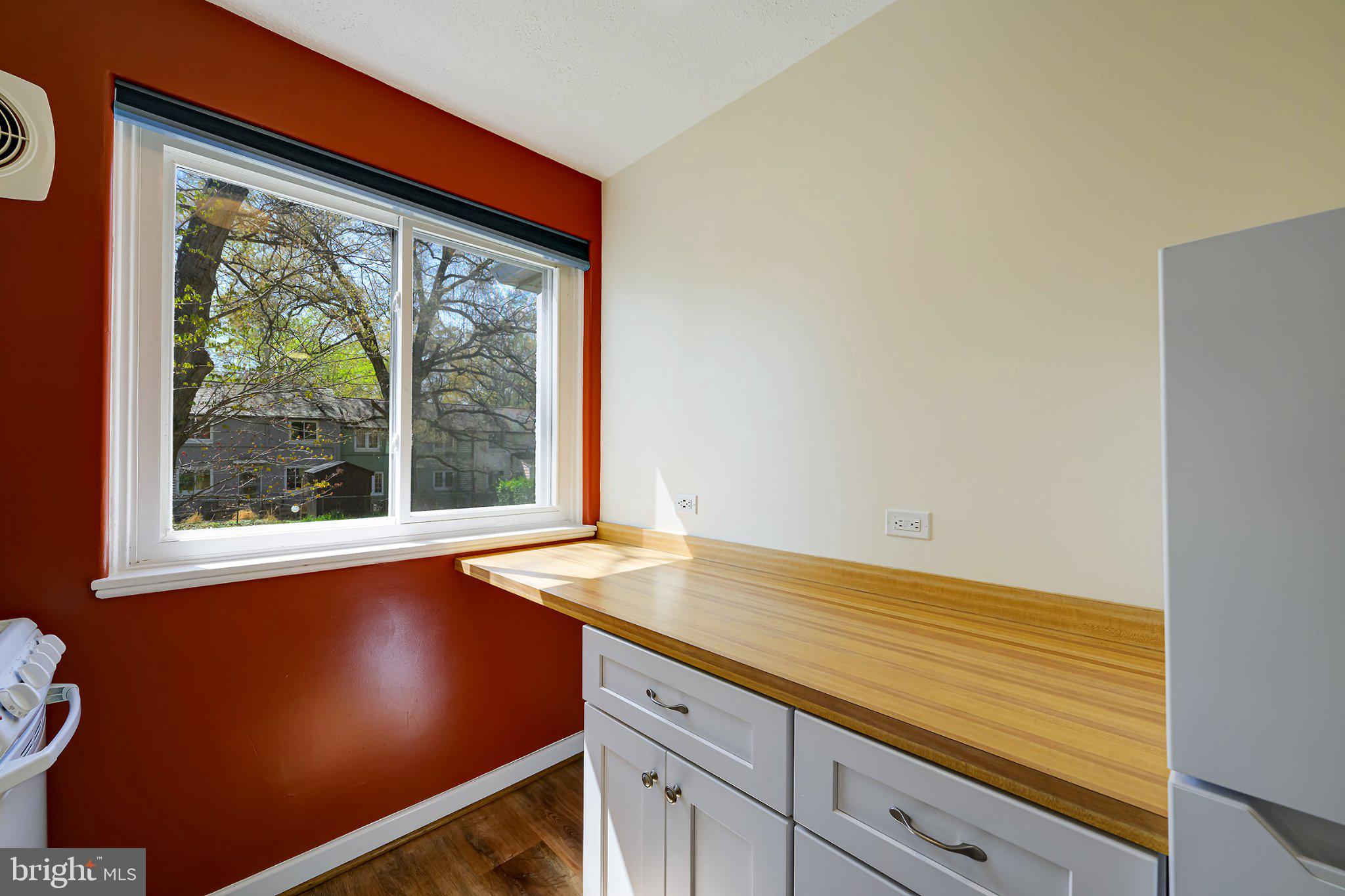 39 Ridge Road Greenbelt, MD 20770 - Photo 10 of 19 a view of a room that has a window and wooden floor