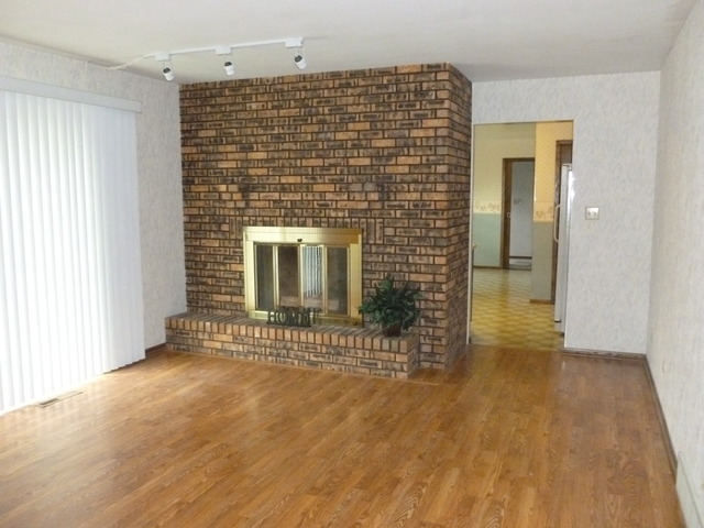 1948 Bilter Road Aurora, IL 60502 - Photo 3 of 25 a view of empty room with a fireplace