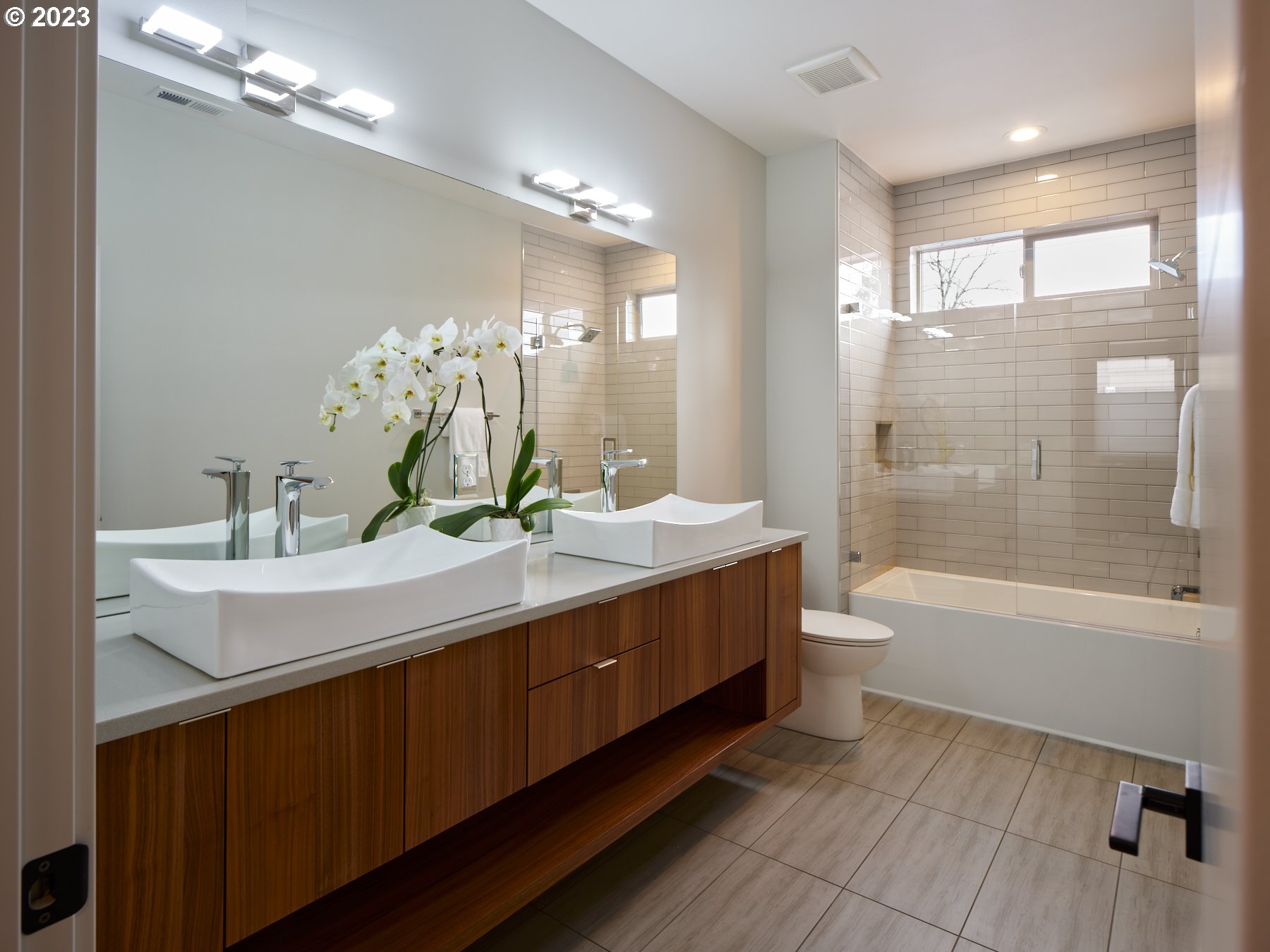 4633 North Adams Street Camas, WA 98607 - Photo 30 of 40 a bathroom with a double vanity sink mirror double and bathtub