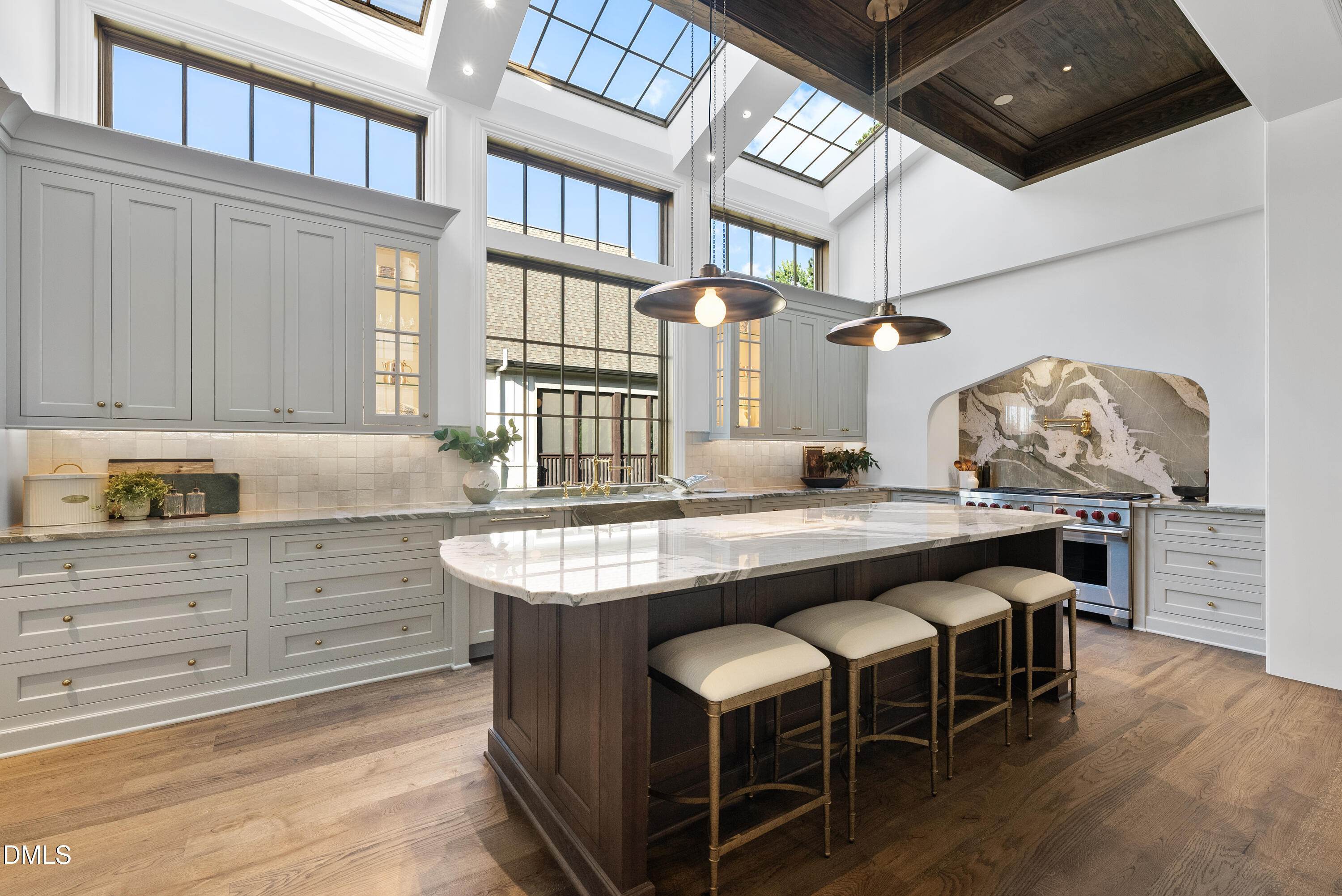 2128 Ridge Road Raleigh, NC 27607 - Photo 32 of 100 a dining hall with stainless steel appliances granite countertop a stove a chimney a sink and cabinets