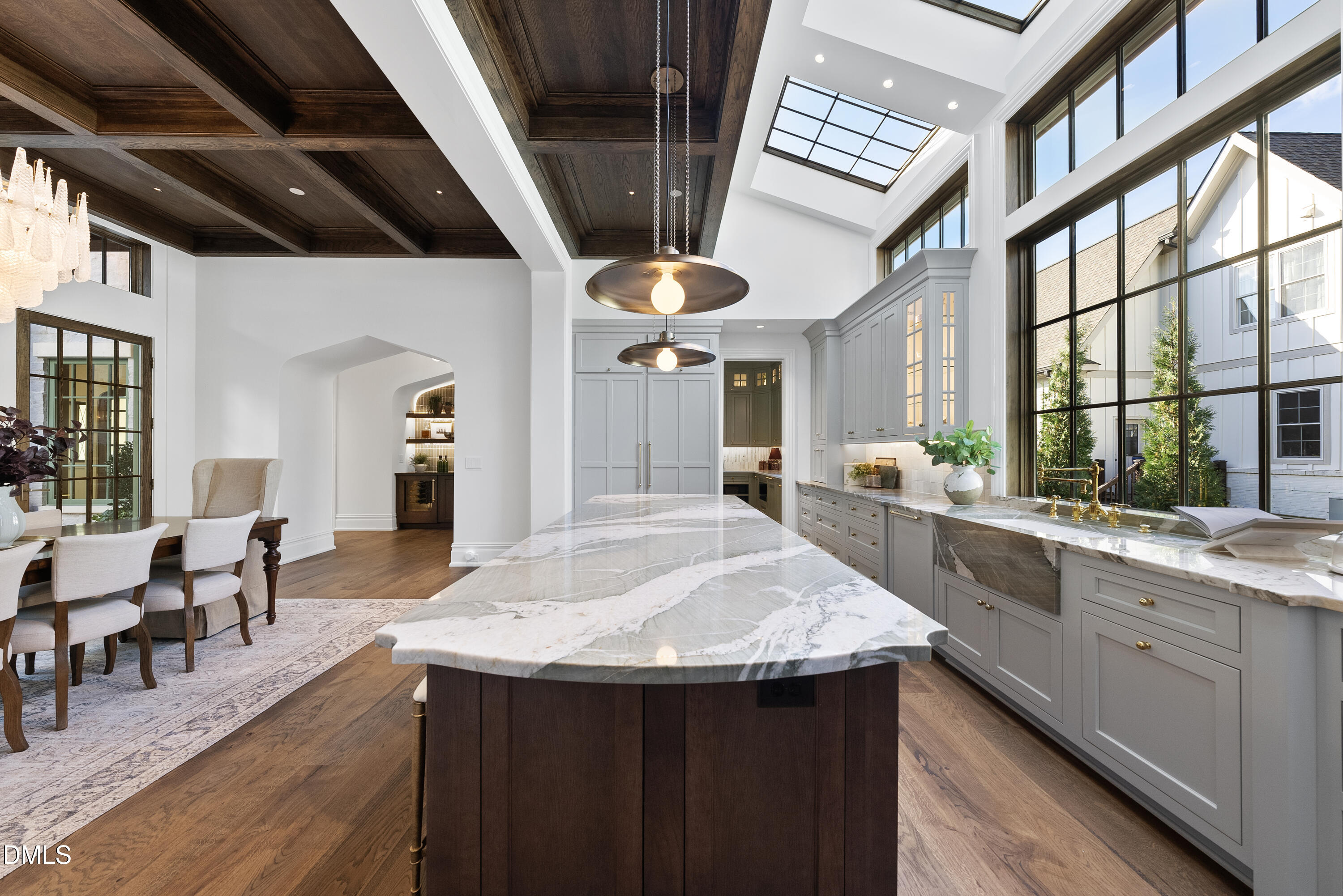 2128 Ridge Road Raleigh, NC 27607 - Photo 36 of 100 a kitchen with stainless steel appliances granite countertop center island a wooden floor and a large window
