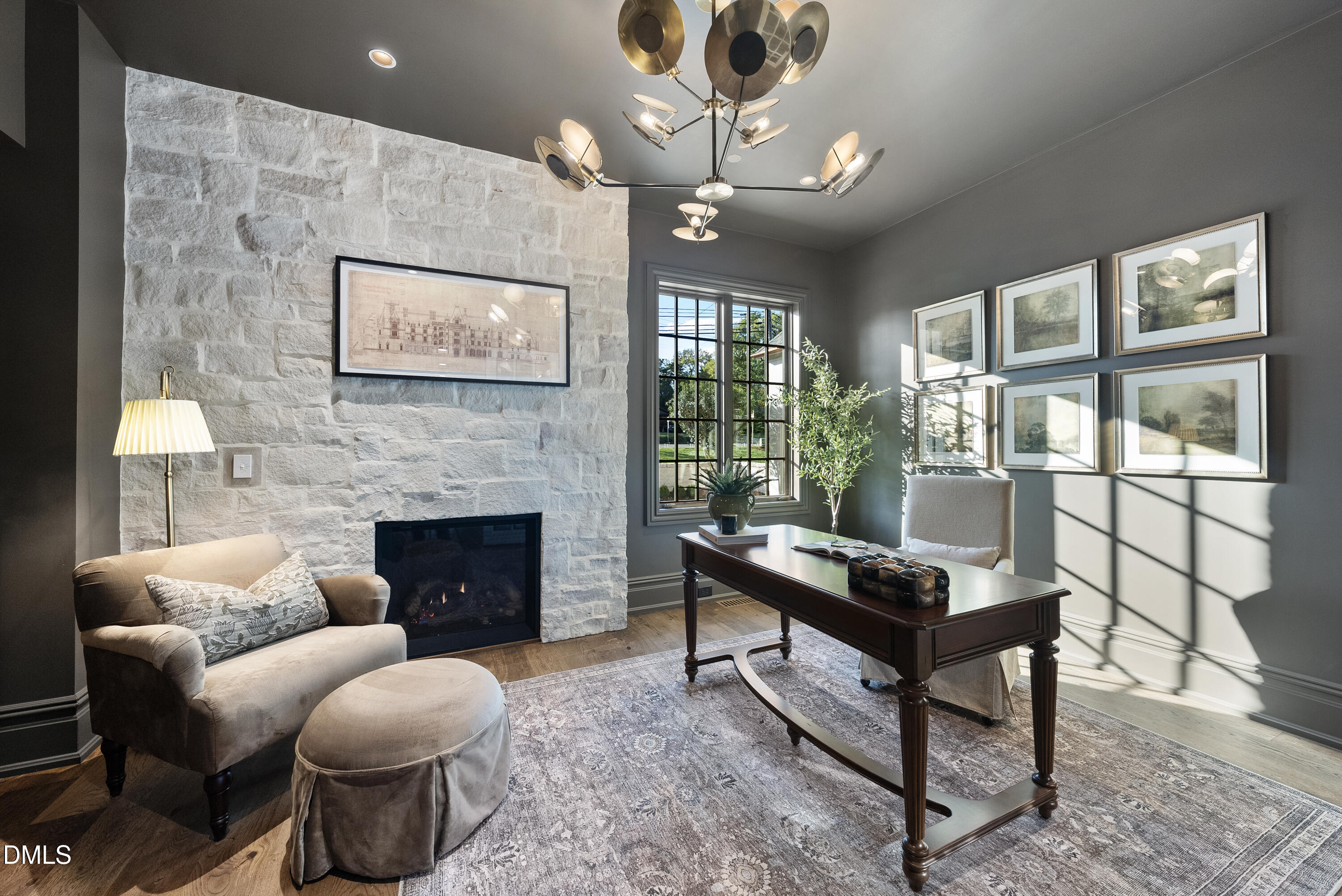 2128 Ridge Road Raleigh, NC 27607 - Photo 62 of 100 a living room with furniture a chandelier and a fireplace