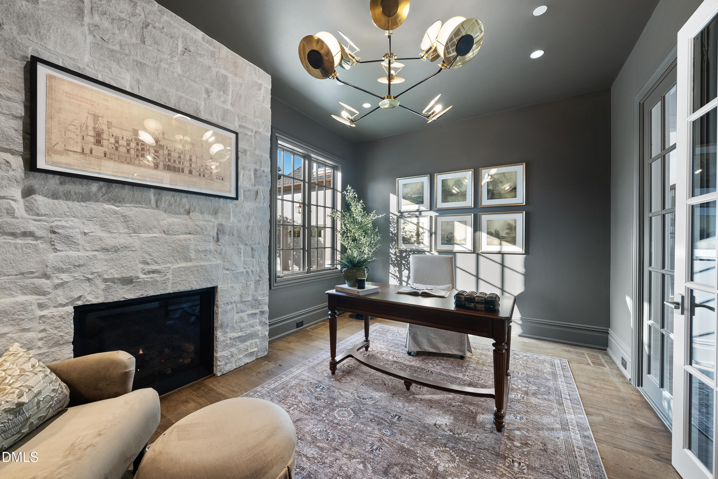 2128 Ridge Road Raleigh, NC 27607 - Photo 63 of 100 a living room with furniture a chandelier and a fireplace