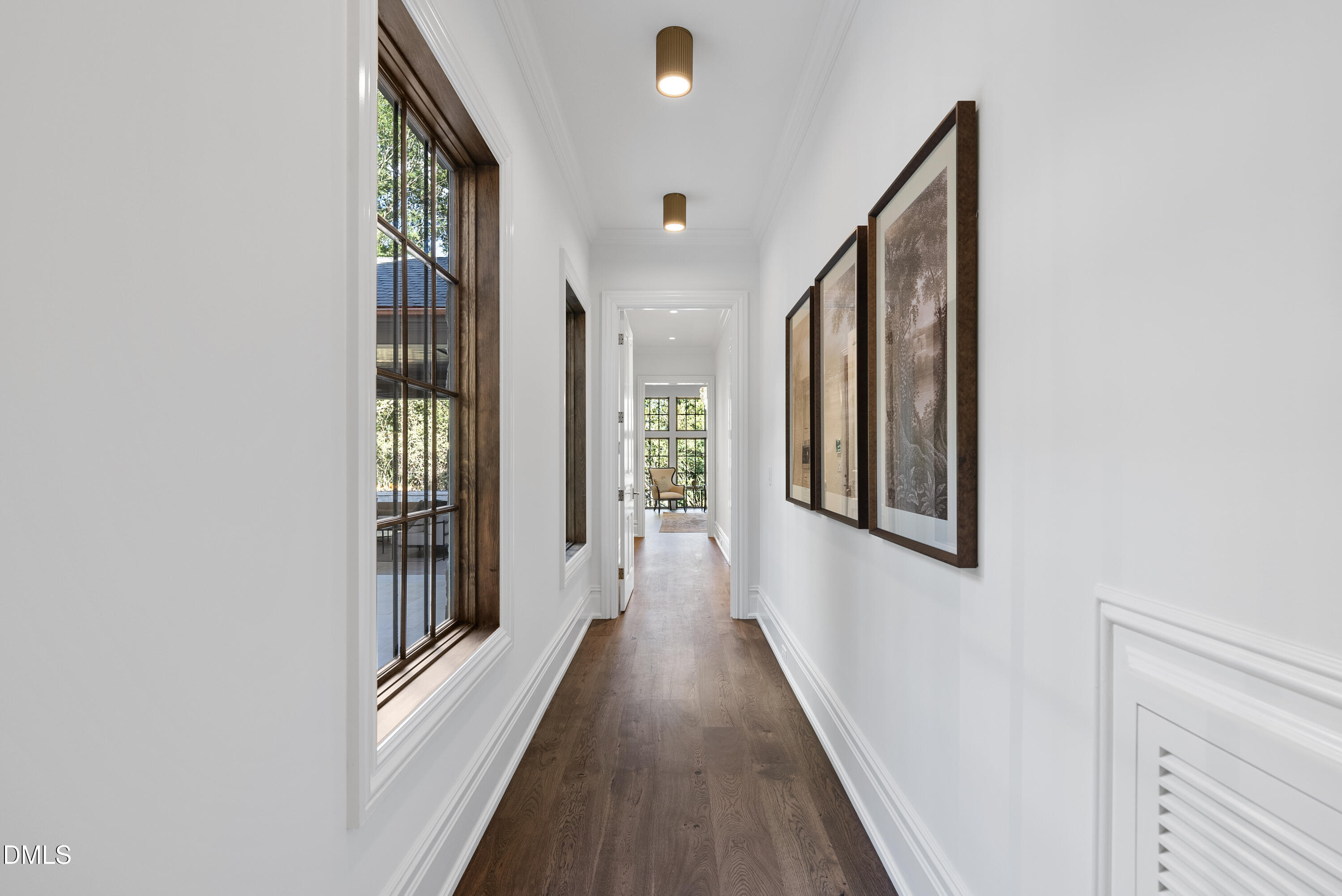 2128 Ridge Road Raleigh, NC 27607 - Photo 65 of 100 a view of a hallway with wooden floor and staircase