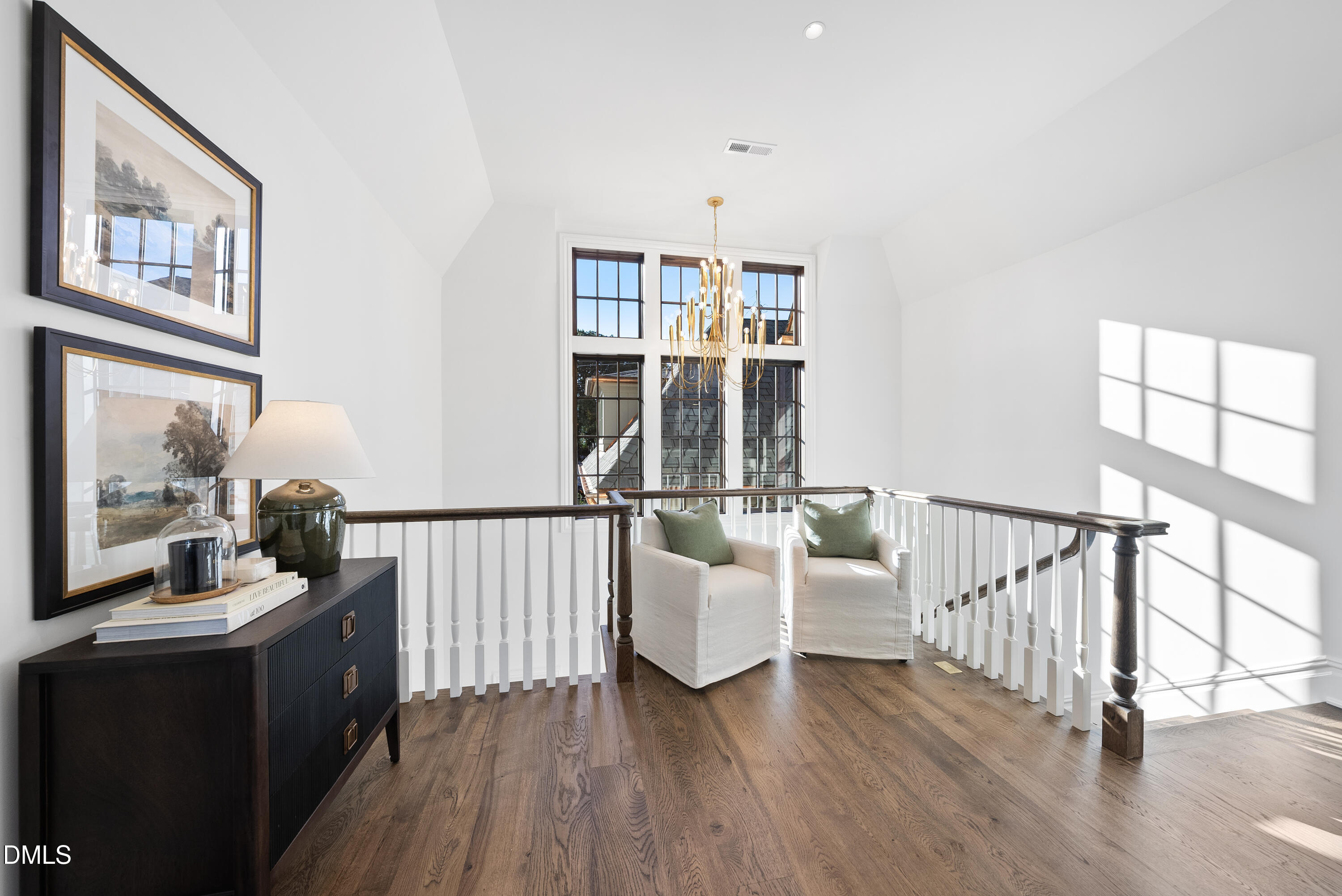 2128 Ridge Road Raleigh, NC 27607 - Photo 79 of 100 a living room with furniture stairs and a wooden floor