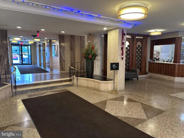 a lobby with furniture and a large window