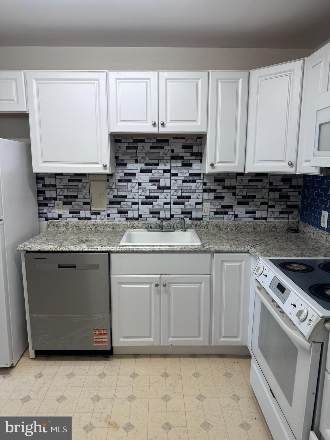 1111 University Boulevard West, Unit 1406A Silver Spring, MD 20902 - Photo 2 of 14 Modern kitchen with sleek finishes.