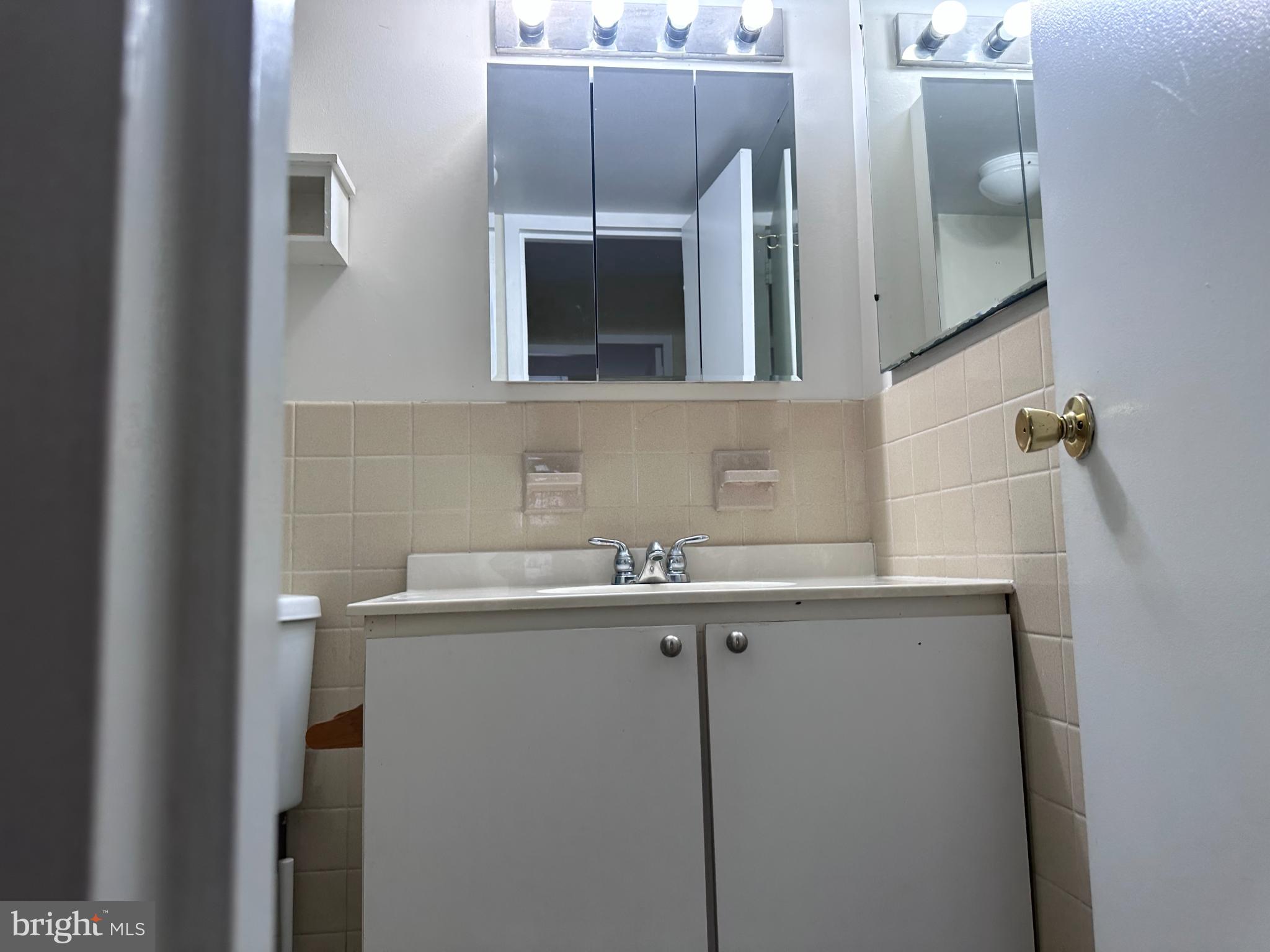 1111 University Boulevard West, Unit 1406A Silver Spring, MD 20902 - Photo 9 of 14 Modern bathroom with sleek fixtures.