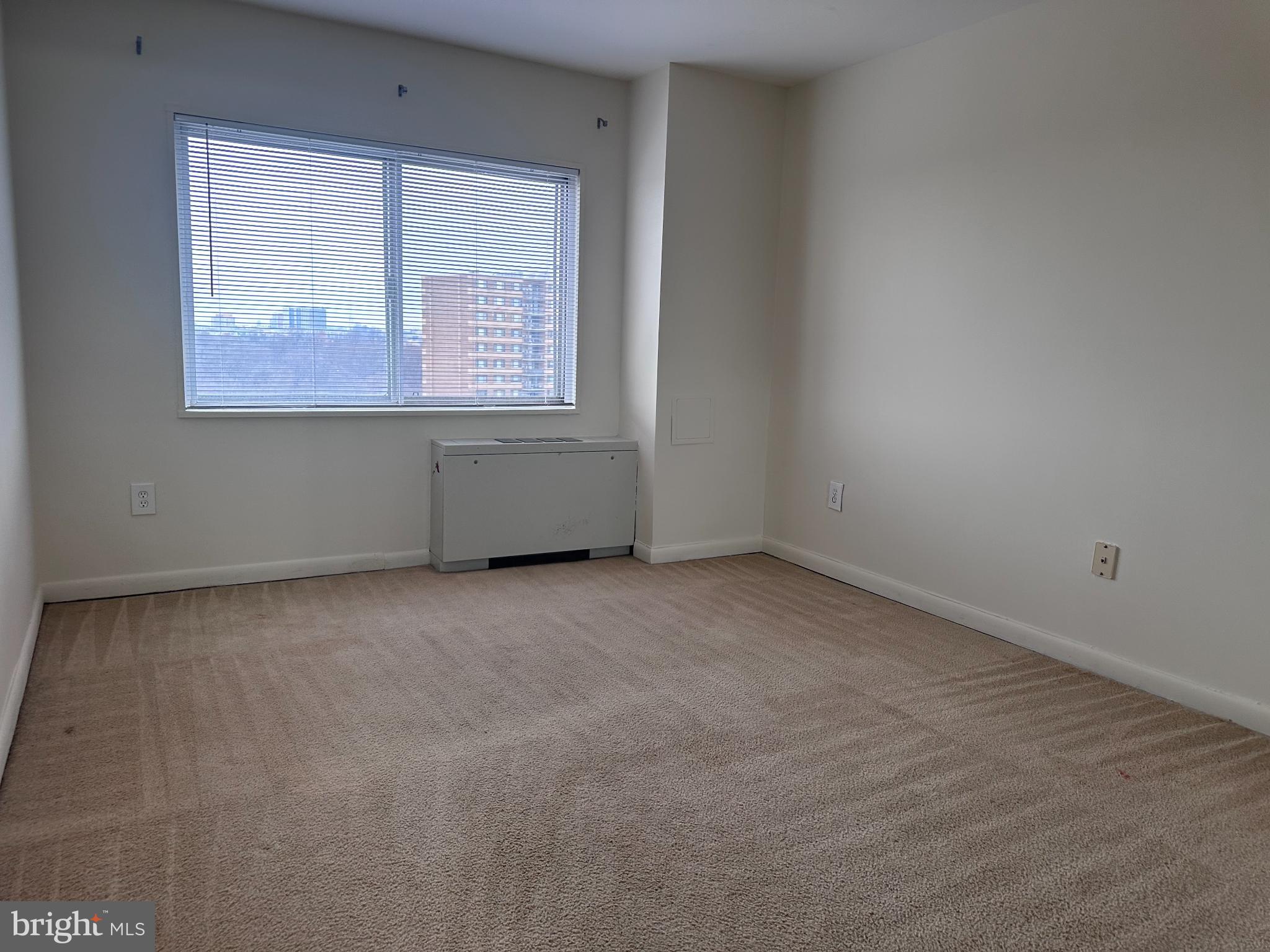 1111 University Boulevard West, Unit 1406A Silver Spring, MD 20902 - Photo 10 of 14 Bright and airy bedroom with city views.