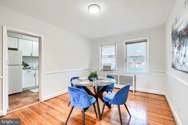 a kitchen with stainless steel appliances granite countertop a sink and a refrigerator