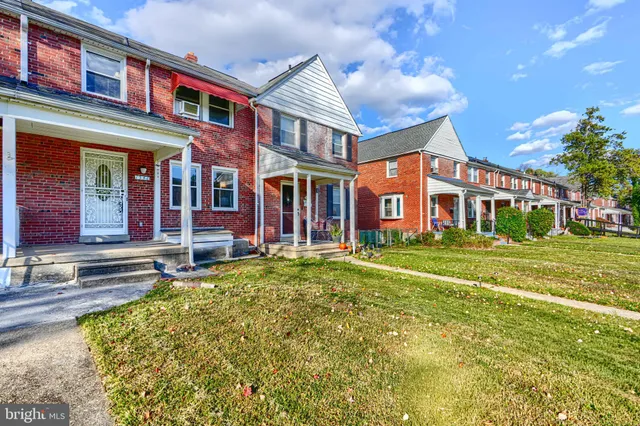 a living room with furniture and a dining table with wooden floor