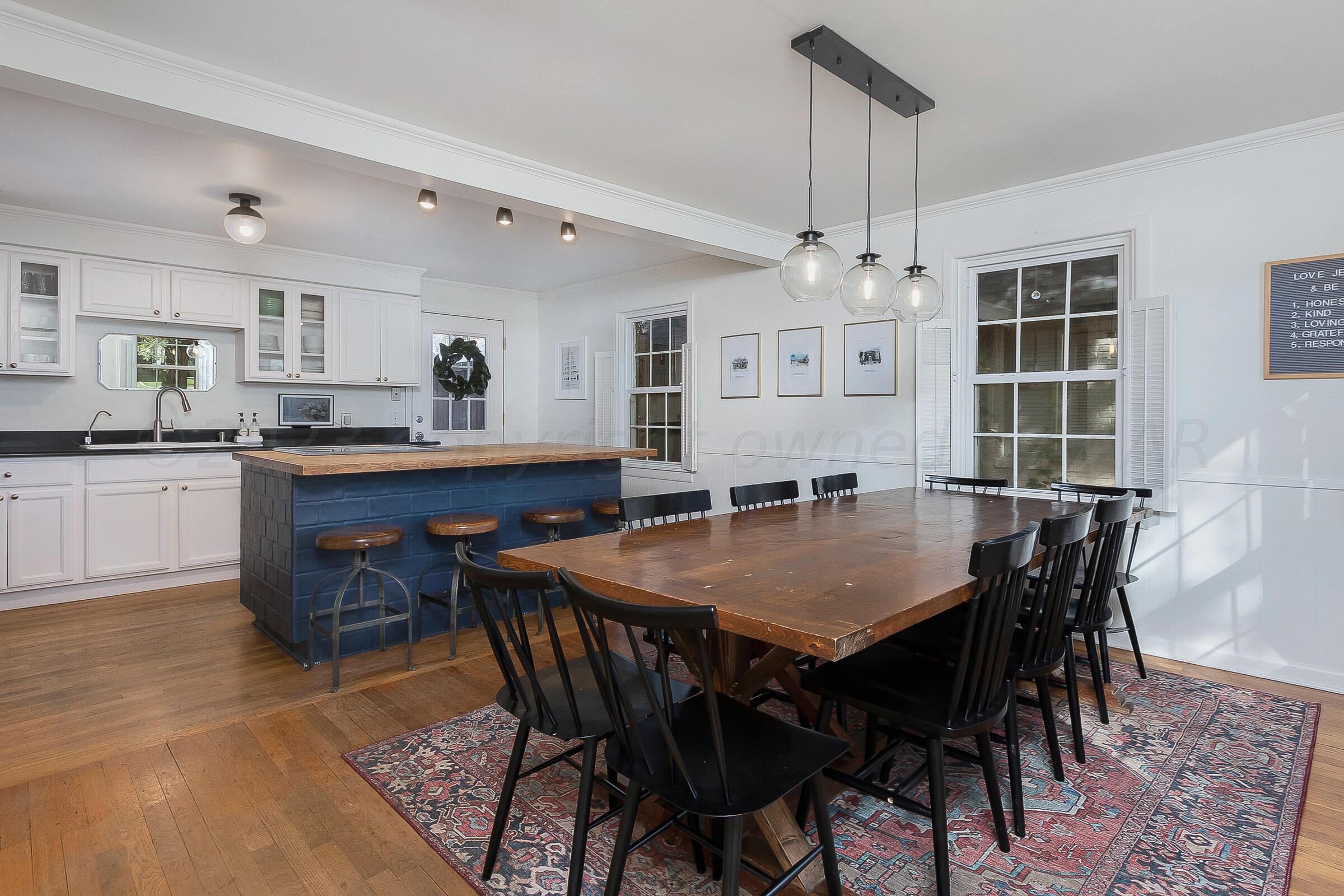 2102 South Hayden Street Amarillo, TX 79109 - Photo 12 of 33 a dining table with chairs and view kitchen