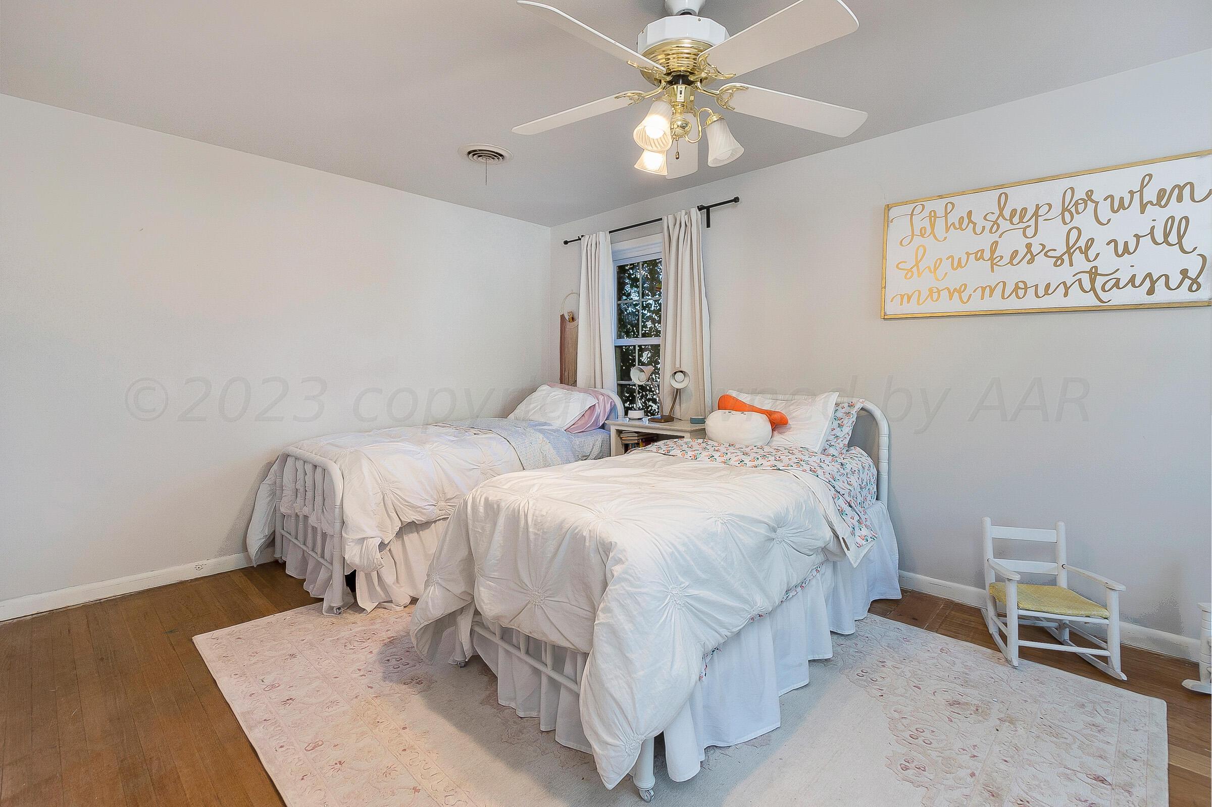 2102 South Hayden Street Amarillo, TX 79109 - Photo 29 of 33 a bedroom with double bed and a window