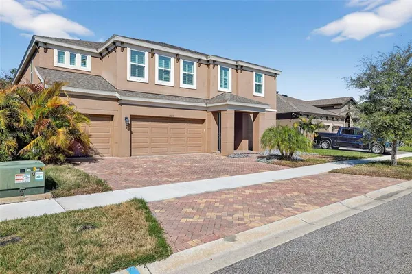 a large kitchen with stainless steel appliances kitchen island granite countertop a sink and cabinets