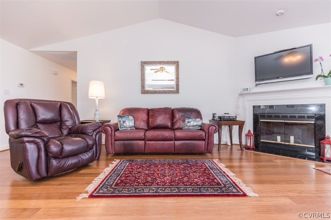 4829 Wakema Road West Point, VA 23181 - Photo 11 of 36 a living room with furniture flat screen tv and a fireplace