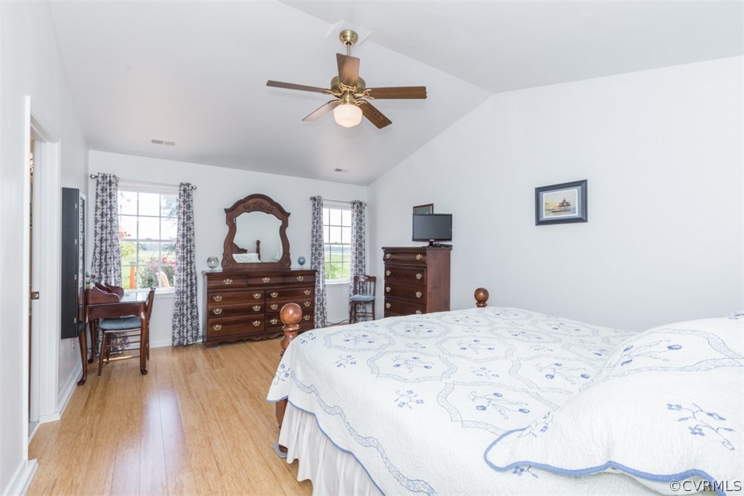 4829 Wakema Road West Point, VA 23181 - Photo 14 of 36 a bed room with a bed window and a chair