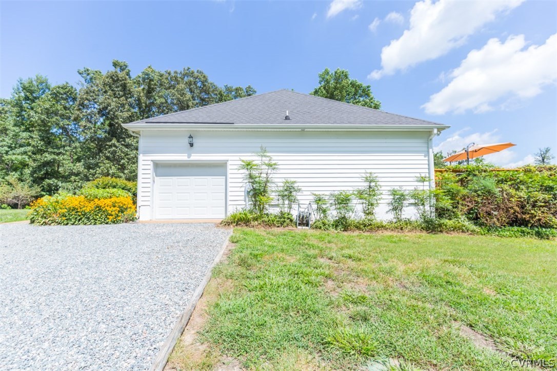 4829 Wakema Road West Point, VA 23181 - Photo 31 of 36 a view of a house with a yard and garage