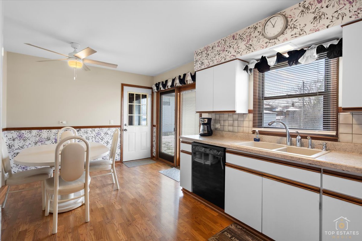 216 Evergreen Street Addison, IL 60101 - Photo 13 of 43 a kitchen with a sink cabinets and window