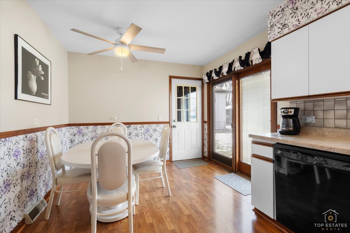 216 Evergreen Street Addison, IL 60101 - Photo 16 of 43 a living room with furniture and a wooden floor