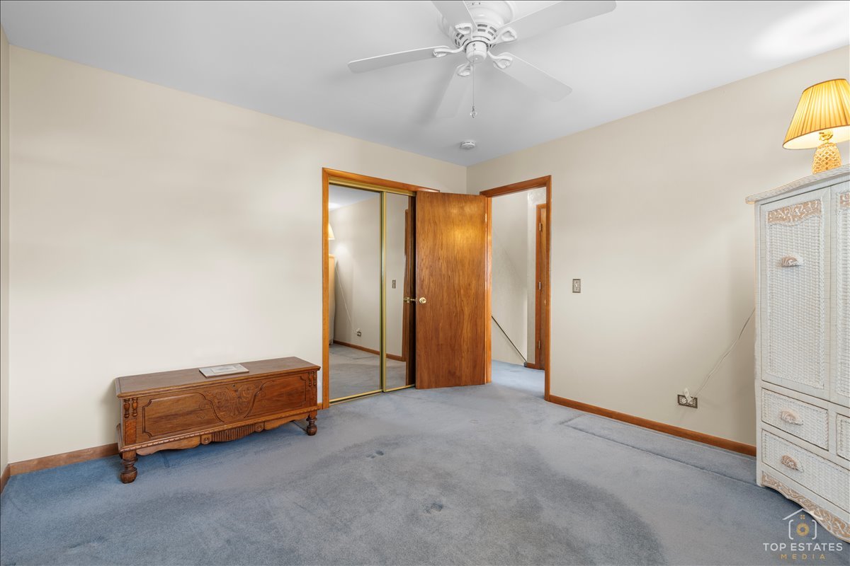 216 Evergreen Street Addison, IL 60101 - Photo 19 of 43 a view of room with workspace and a ceiling fan