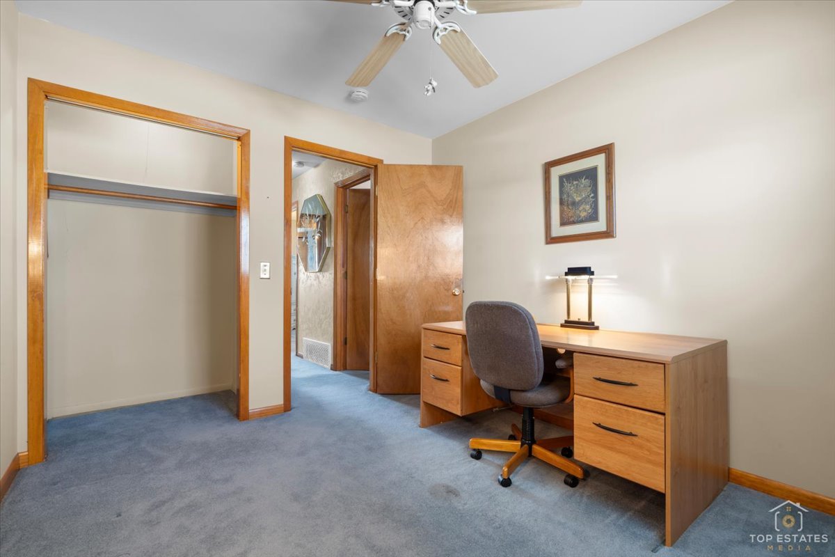 216 Evergreen Street Addison, IL 60101 - Photo 23 of 43 a view of a workspace with furniture and a window