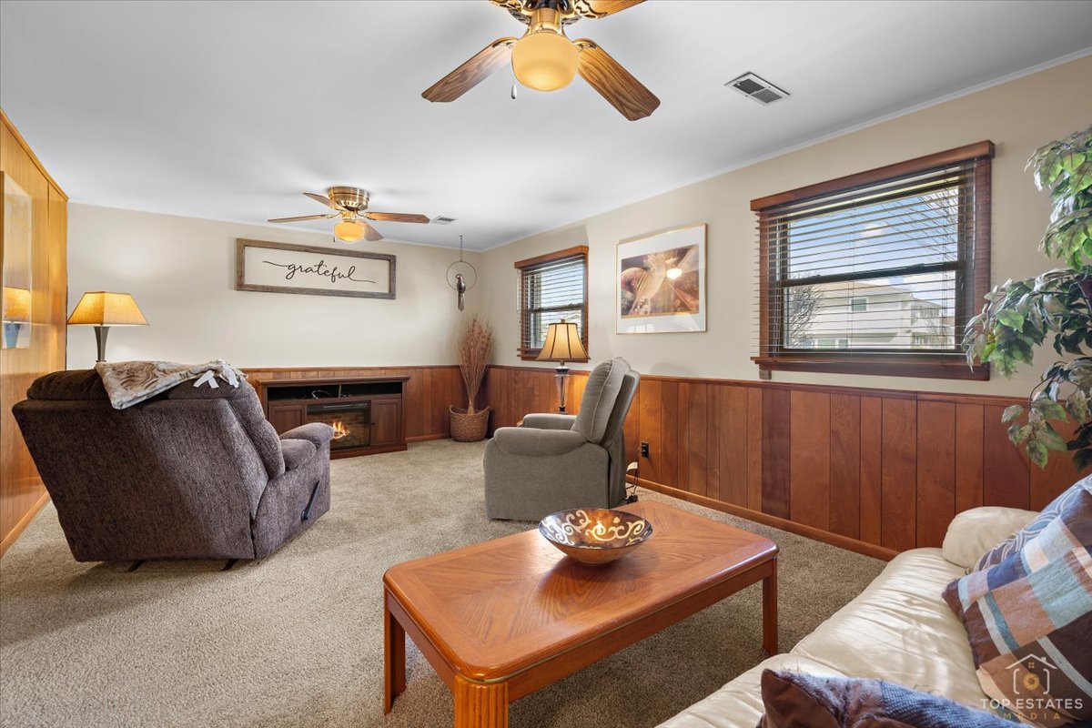 216 Evergreen Street Addison, IL 60101 - Photo 25 of 43 a living room with furniture and a window