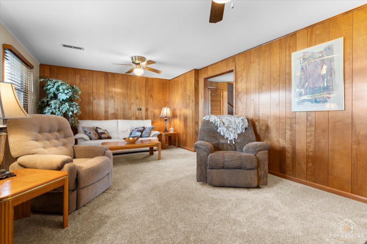 216 Evergreen Street Addison, IL 60101 - Photo 27 of 43 a living room with furniture and a large window