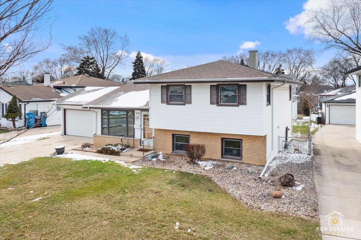 216 Evergreen Street Addison, IL 60101 - Photo 7 of 43 a view of a house with backyard and sitting area